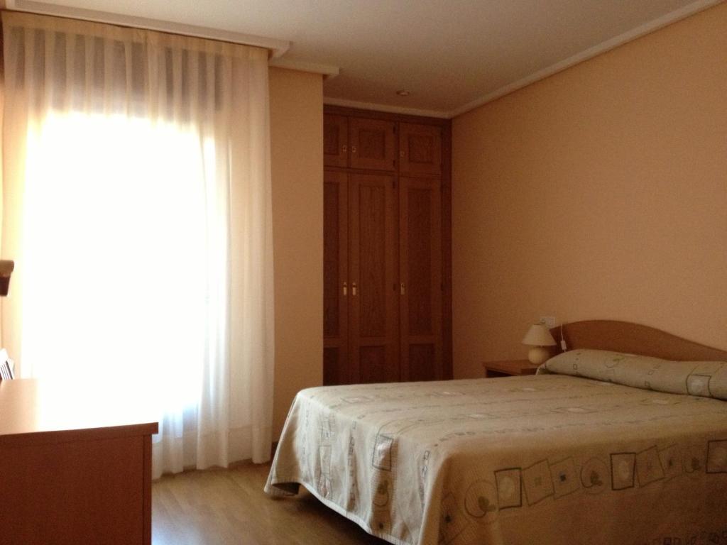 Apartamentos Turisticos Puerta De León Pokoj fotografie